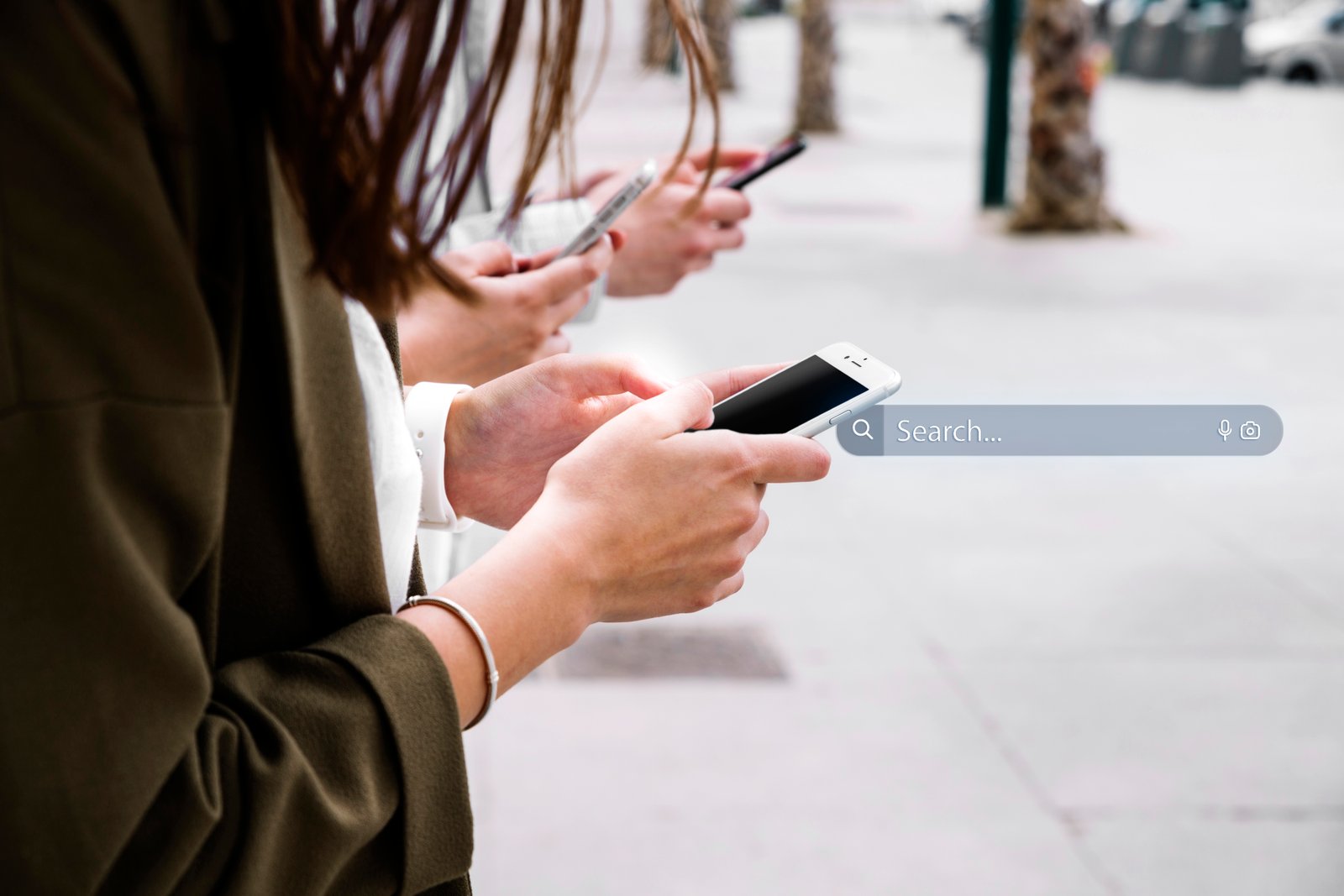 Hands searching on a smartphone